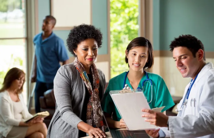 Health care workers reviewing nonprofit fundraising.