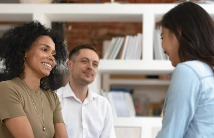 two women shaking hands